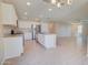 Bright kitchen with stainless steel appliances, granite countertops, and a spacious island perfect for cooking at 809 W Kingman Dr, Casa Grande, AZ 85122
