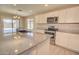 This kitchen has granite countertops, stainless steel appliances and tile flooring at 809 W Kingman Dr, Casa Grande, AZ 85122