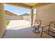 Covered patio with chairs, offering a relaxing outdoor space at 809 W Kingman Dr, Casa Grande, AZ 85122