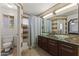 Stylish bathroom with vessel sinks, tiled walls, and a modern shower area at 8234 W Sweetwater Ave, Peoria, AZ 85381