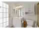 Bathroom featuring a vanity with mirror, bright lighting, and a toilet at 8234 W Sweetwater Ave, Peoria, AZ 85381