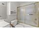 Clean bathroom with tub-shower combo, storage cabinet, and neutral color scheme at 8234 W Sweetwater Ave, Peoria, AZ 85381