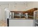 Spacious kitchen with stainless steel appliances, dark cabinetry, and a modern design, perfect for cooking at 8234 W Sweetwater Ave, Peoria, AZ 85381