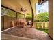 Cozy backyard patio with brick pavers, wood pergola, ceiling fans, and comfortable seating for relaxing outdoors at 936 E Gila Ln, Chandler, AZ 85225