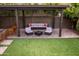 Inviting backyard patio area with comfortable seating under a pergola, ideal for relaxation and social gatherings at 936 E Gila Ln, Chandler, AZ 85225