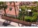 Private backyard with well-maintained landscaping, palm trees, and lush green space surrounded by block wall at 936 E Gila Ln, Chandler, AZ 85225