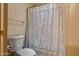 Clean and functional bathroom with a toilet and a stylish shower curtain at 936 E Gila Ln, Chandler, AZ 85225