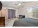 Relaxing bedroom featuring a vaulted ceiling and a large window providing natural light at 936 E Gila Ln, Chandler, AZ 85225