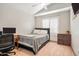 Cozy bedroom with a bed, desk and shutters on the window, offering a comfortable and private space at 936 E Gila Ln, Chandler, AZ 85225