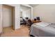 Bedroom with a large mirrored closet door showing the second bed and a desk for remote work at 936 E Gila Ln, Chandler, AZ 85225