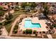Aerial view of the community pool with seating, lush landscaping, and mature trees at 936 E Gila Ln, Chandler, AZ 85225