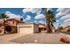Lovely home with a convenient two-car garage, desert landscaping, and an inviting, well-maintained exterior at 936 E Gila Ln, Chandler, AZ 85225