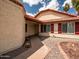 Welcoming front entrance featuring decorative desert landscaping, a covered porch, and a charming façade at 936 E Gila Ln, Chandler, AZ 85225