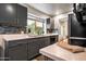 Modern kitchen sink with quartz countertop, gray cabinets, tile backsplash and a window overlooking the backyard at 936 E Gila Ln, Chandler, AZ 85225