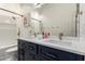 Stylish bathroom featuring double sinks, modern fixtures, and a tub at 9548 E Grandview St, Mesa, AZ 85207