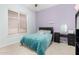 Comfortable bedroom featuring a plush blue bedspread, desk, and vanity for a cozy retreat at 9548 E Grandview St, Mesa, AZ 85207