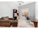Bright bedroom with ample natural light, a brown leather chair, an ottoman, and built-in shelving at 9548 E Grandview St, Mesa, AZ 85207