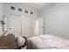 Cozy bedroom with closet, desk, and natural light at 9548 E Grandview St, Mesa, AZ 85207