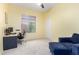 Bright bedroom featuring a desk, chair, and comfortable seating, perfect for work or relaxation at 9548 E Grandview St, Mesa, AZ 85207
