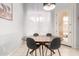 Bright dining area with round table, backyard views and modern lighting at 9548 E Grandview St, Mesa, AZ 85207