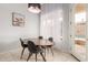 Cozy dining area with backyard pool views and modern lighting at 9548 E Grandview St, Mesa, AZ 85207