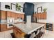 Spacious kitchen with a large island, modern appliances, oak cabinets, and stylish decor at 9548 E Grandview St, Mesa, AZ 85207