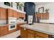 Bright kitchen with custom cabinetry, concrete island countertop, and modern appliances at 9548 E Grandview St, Mesa, AZ 85207