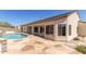 Inviting backyard pool with patterned concrete patio and stucco exterior at 9548 E Grandview St, Mesa, AZ 85207
