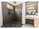 Modern shower featuring sleek tile work and multiple showerheads at 9548 E Grandview St, Mesa, AZ 85207
