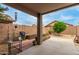 Covered patio with a built-in garden area and well-maintained landscaping at 11410 W Davis Ln, Avondale, AZ 85323