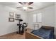 Bedroom with ceiling fan, window, and medical equipment, offering comfort and functionality at 11410 W Davis Ln, Avondale, AZ 85323