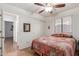 Comfortable bedroom featuring a ceiling fan and natural light from the window at 11410 W Davis Ln, Avondale, AZ 85323