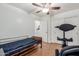 Bedroom with ceiling fan, medical equipment, and walk-in closet, promotes comfort and accessibility at 11410 W Davis Ln, Avondale, AZ 85323