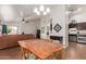Combined dining and living space with open layout and cozy furniture at 11410 W Davis Ln, Avondale, AZ 85323