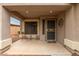 Inviting front porch with tile flooring, comfortable seating, and decorative accents at 11410 W Davis Ln, Avondale, AZ 85323