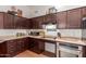 Kitchen features stainless steel appliances, and ample counter space at 11410 W Davis Ln, Avondale, AZ 85323