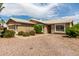 Charming single-story home with a low-maintenance desert-style front yard at 11520 W Lizard Ct, Surprise, AZ 85378