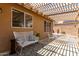 Charming covered patio with ample seating provides a comfortable outdoor space with a pergola at 11520 W Lizard Ct, Surprise, AZ 85378