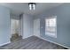 Light blue bedroom with neutral flooring, bright light fixture and attached bathroom at 11596 W Sierra Dawn Blvd # 165, Surprise, AZ 85378
