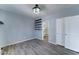 Bedroom with neutral flooring, built in shelves, and an attached bathroom at 11596 W Sierra Dawn Blvd # 165, Surprise, AZ 85378