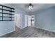 Light blue bedroom with neutral flooring, built in shelves, and a view into the kitchen at 11596 W Sierra Dawn Blvd # 165, Surprise, AZ 85378