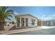 Exterior view of a manufactured home with covered carport and porch, with desert landscaping at 11596 W Sierra Dawn Blvd # 165, Surprise, AZ 85378