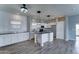 Bright kitchen featuring a center island, modern appliances, and granite countertops at 11596 W Sierra Dawn Blvd # 165, Surprise, AZ 85378