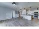 Spacious living room featuring modern gray walls, flooring, and updated lighting fixtures at 11596 W Sierra Dawn Blvd # 165, Surprise, AZ 85378