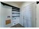 Mud room area with white door, stacked shelving, and utility hookups at 11596 W Sierra Dawn Blvd # 165, Surprise, AZ 85378