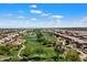 Expansive aerial view showcasing a golf course community and desert landscape at 11650 W Pincushion Ct, Surprise, AZ 85378