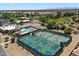 Aerial view of community amenities: pool, tennis and pickleball courts at 11650 W Pincushion Ct, Surprise, AZ 85378