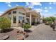 Enjoy a relaxing backyard with desert landscape, covered patio, brick pavers and plenty of room for entertaining at 11650 W Pincushion Ct, Surprise, AZ 85378