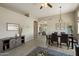 Inviting living area with dining space, modern decor, and wood-look tile flooring at 11650 W Pincushion Ct, Surprise, AZ 85378