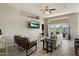 Cozy living room with modern furniture, TV, and sliding glass doors to the backyard at 11650 W Pincushion Ct, Surprise, AZ 85378